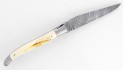 Couteau Laguiole 12 cm double platine, mitres inox brossé en ivoire de phacochère, lame damas carbone.
